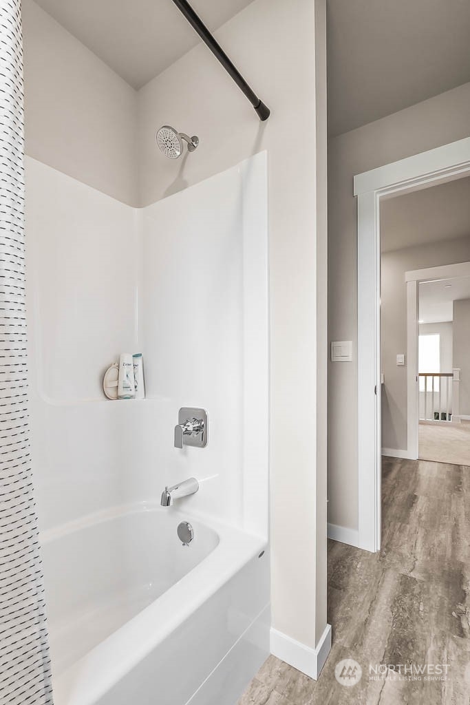 16213 Southeast 133rd Place, Unit 113 Renton, WA 98059 - Photo 22 of 30 a bathroom with a bathtub