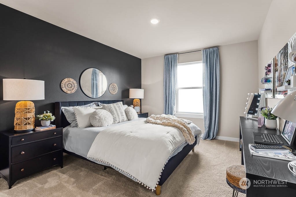 16213 Southeast 133rd Place, Unit 113 Renton, WA 98059 - Photo 23 of 30 a bedroom with bed and windows