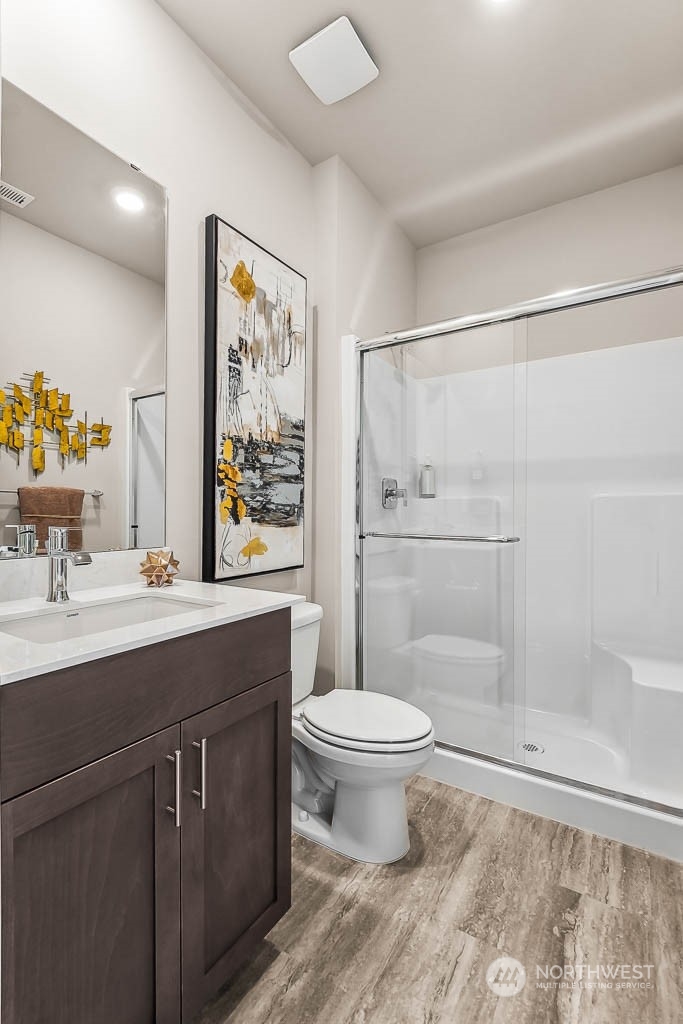 16213 Southeast 133rd Place, Unit 113 Renton, WA 98059 - Photo 30 of 30 a bathroom with a sink toilet and shower