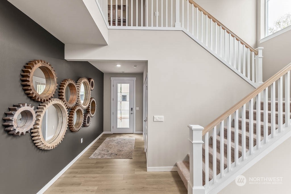 16213 Southeast 133rd Place, Unit 113 Renton, WA 98059 - Photo 4 of 30 a view of a hallway with entryway wooden floor