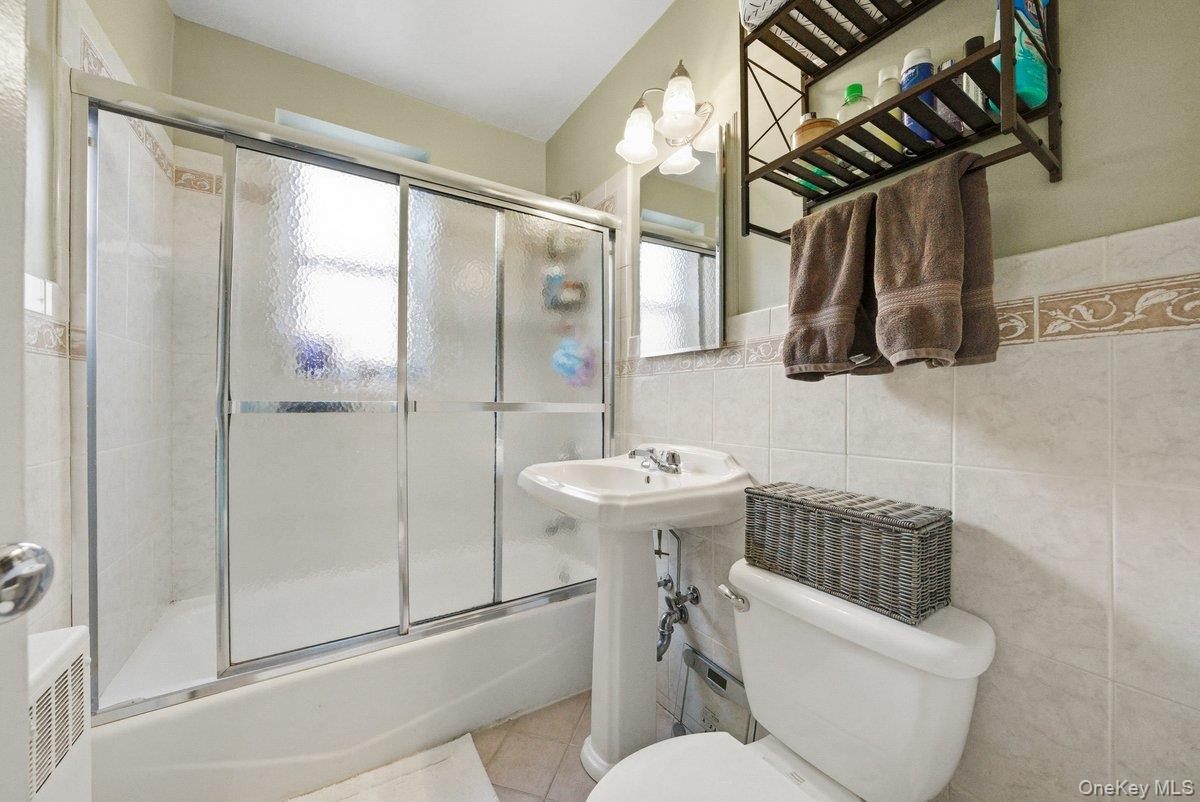 781 Palmer Road, Unit 2D Yonkers, NY 10708 - Photo 11 of 17 a bathroom with a sink toilet and shower
