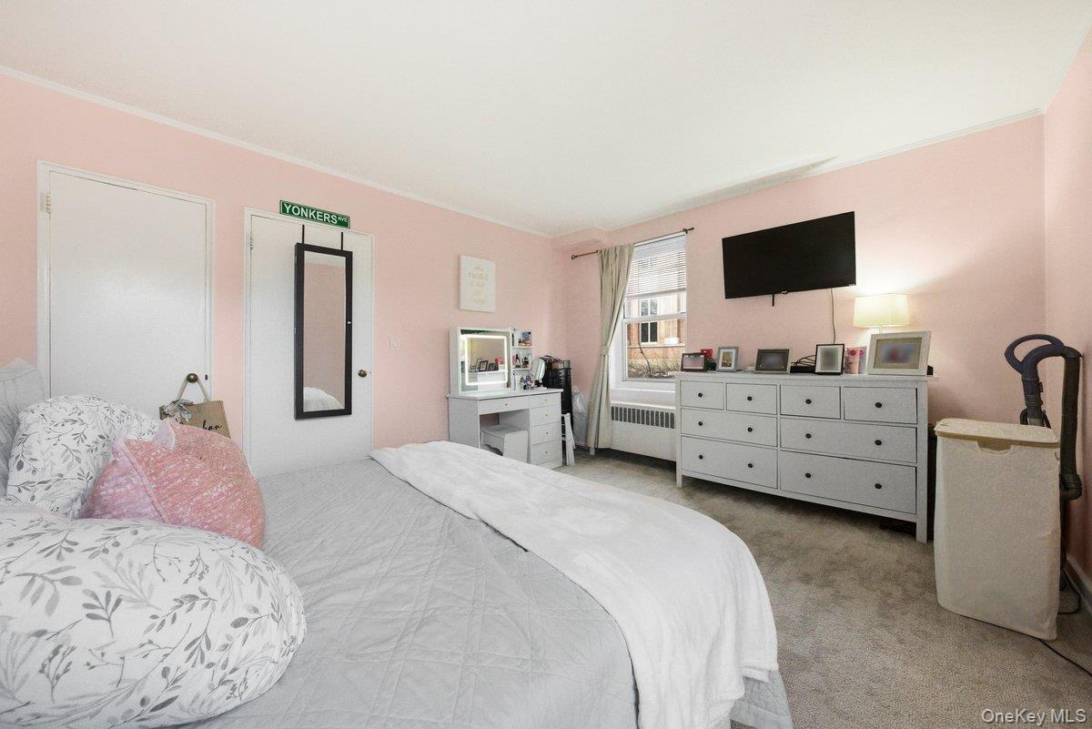 781 Palmer Road, Unit 2D Yonkers, NY 10708 - Photo 12 of 17 a bedroom with a bed and a television