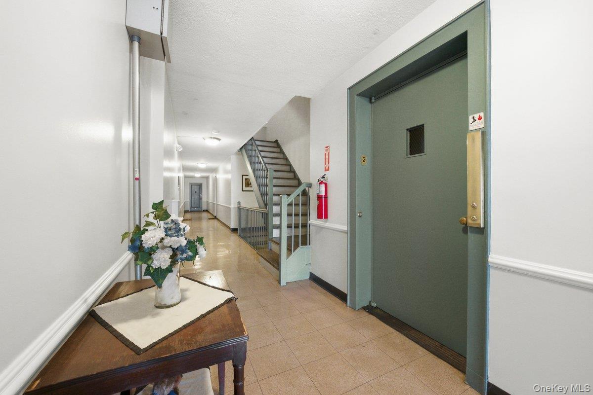 781 Palmer Road, Unit 2D Yonkers, NY 10708 - Photo 3 of 17 a hallway with furniture and a potted plant