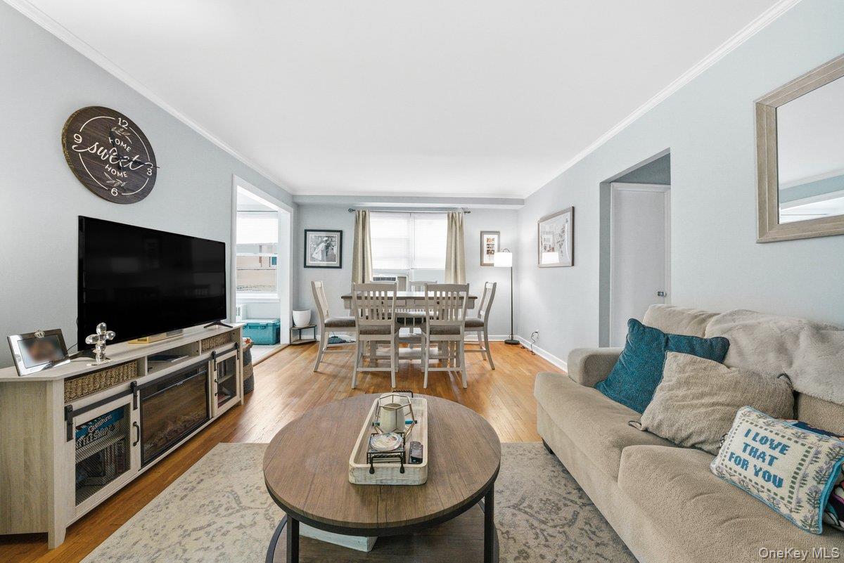 781 Palmer Road, Unit 2D Yonkers, NY 10708 - Photo 8 of 17 a living room with furniture and a flat screen tv