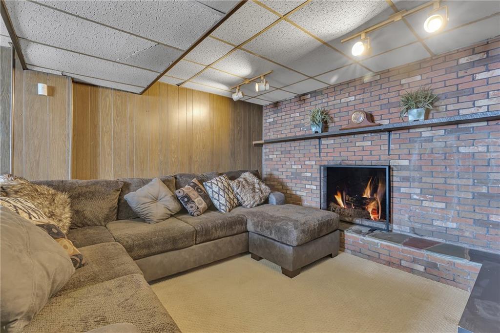 1281 Chapel Road Monaca, PA 15061 - Photo 6 of 34 Cozy finished basement with fireplace.