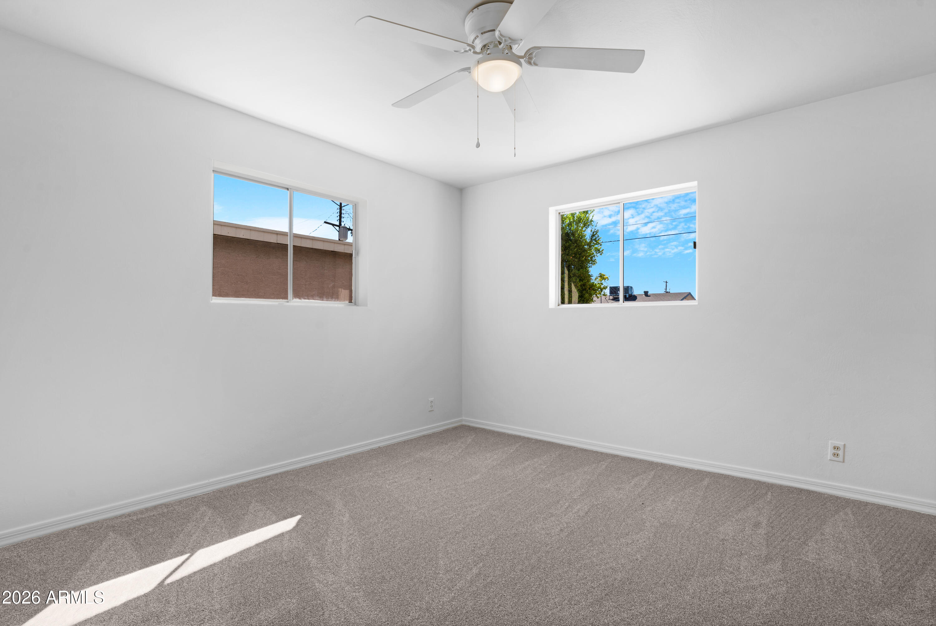 5437 East Butte Street Mesa, AZ 85205 - Photo 33 of 56 an empty room with a window
