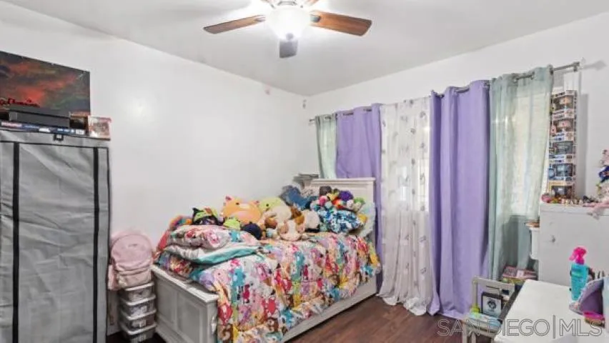 753 Jacumba Street San Diego, CA 92114 - Photo 12 of 22 a bed room with a bed and a television