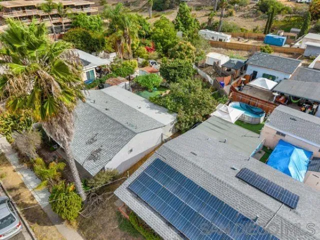 an aerial view of a house with outdoor space