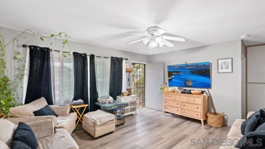 753 Jacumba Street San Diego, CA 92114 - Photo 6 of 22 a living room with furniture and a large window