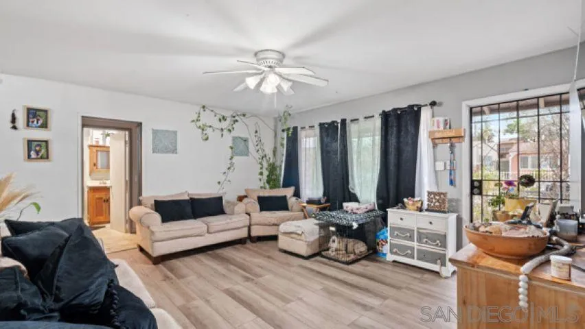 753 Jacumba Street San Diego, CA 92114 - Photo 7 of 22 a living room with furniture and a large window