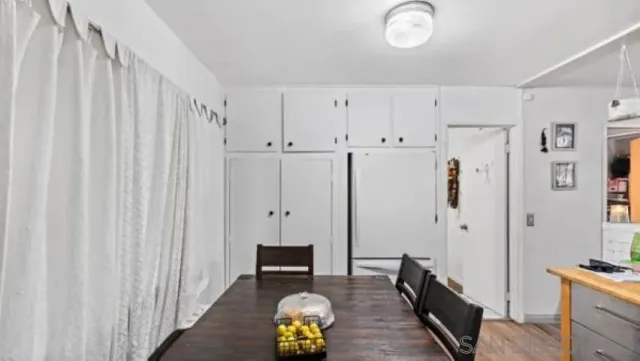 a view of kitchen with furniture and wooden floor