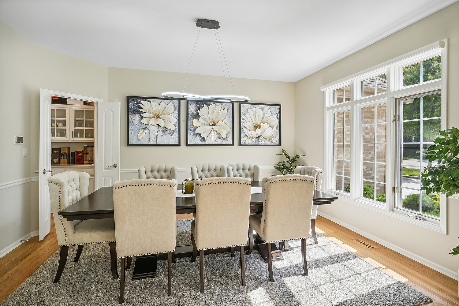 9033 Kearney Road Darien, IL 60561 - Photo 15 of 38 a dining room with furniture and windows