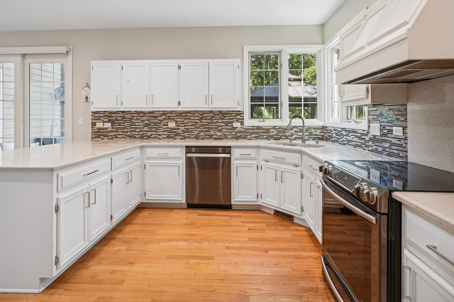9033 Kearney Road Darien, IL 60561 - Photo 20 of 38 a kitchen with stainless steel appliances granite countertop a stove and a sink