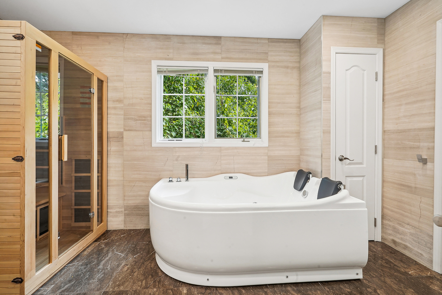 9033 Kearney Road Darien, IL 60561 - Photo 29 of 38 a white bath tub sitting in a bathroom next to a window