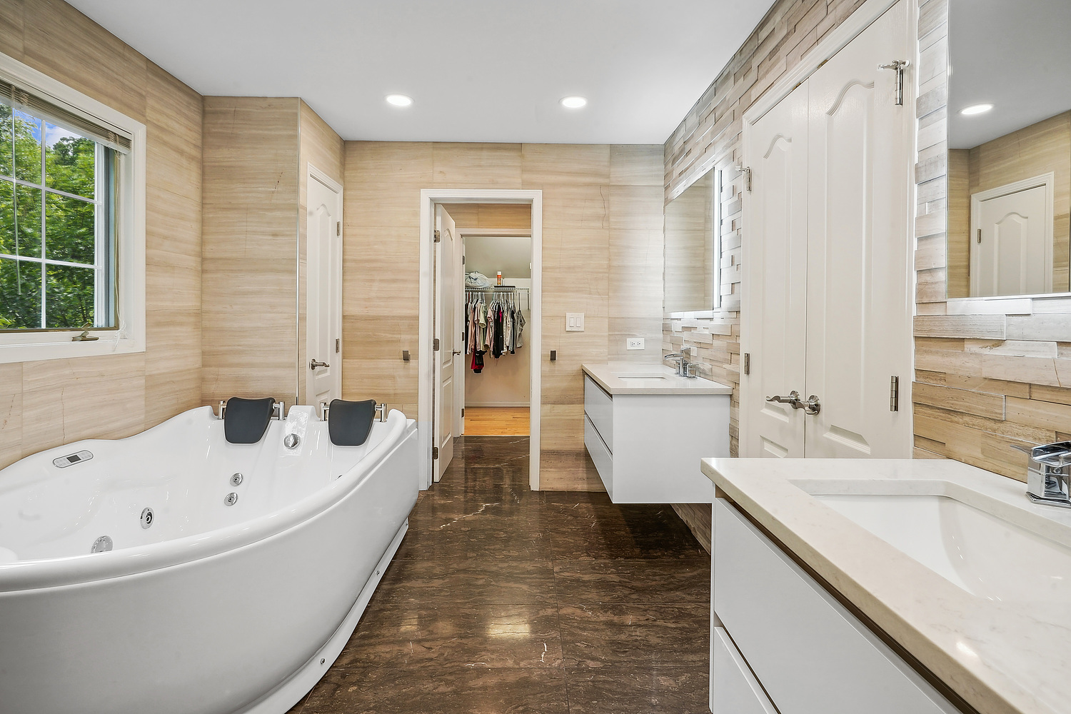 9033 Kearney Road Darien, IL 60561 - Photo 30 of 38 a bathroom with a tub a sink a mirror and a shower