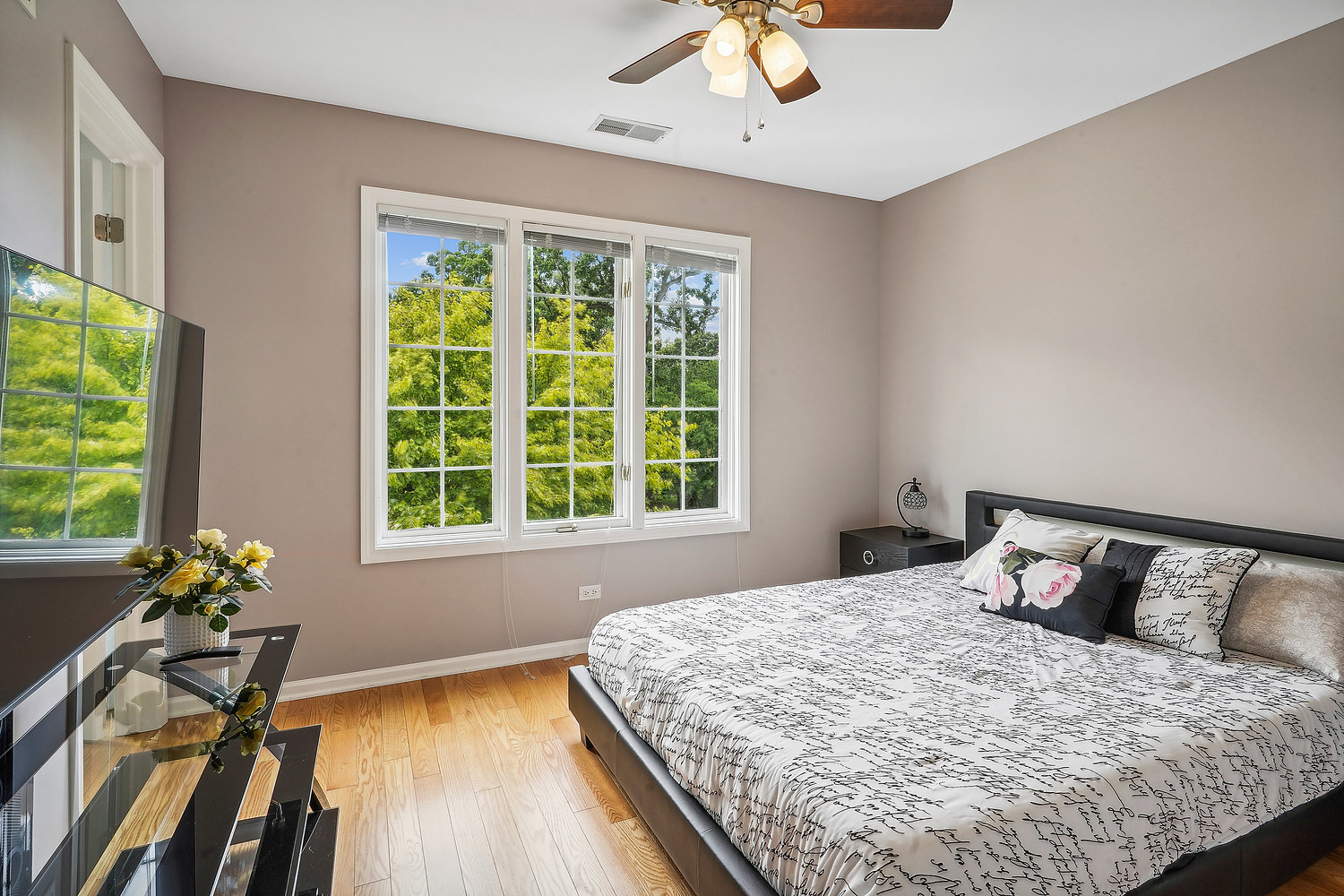 9033 Kearney Road Darien, IL 60561 - Photo 34 of 38 a bedroom with a bed and wooden floor