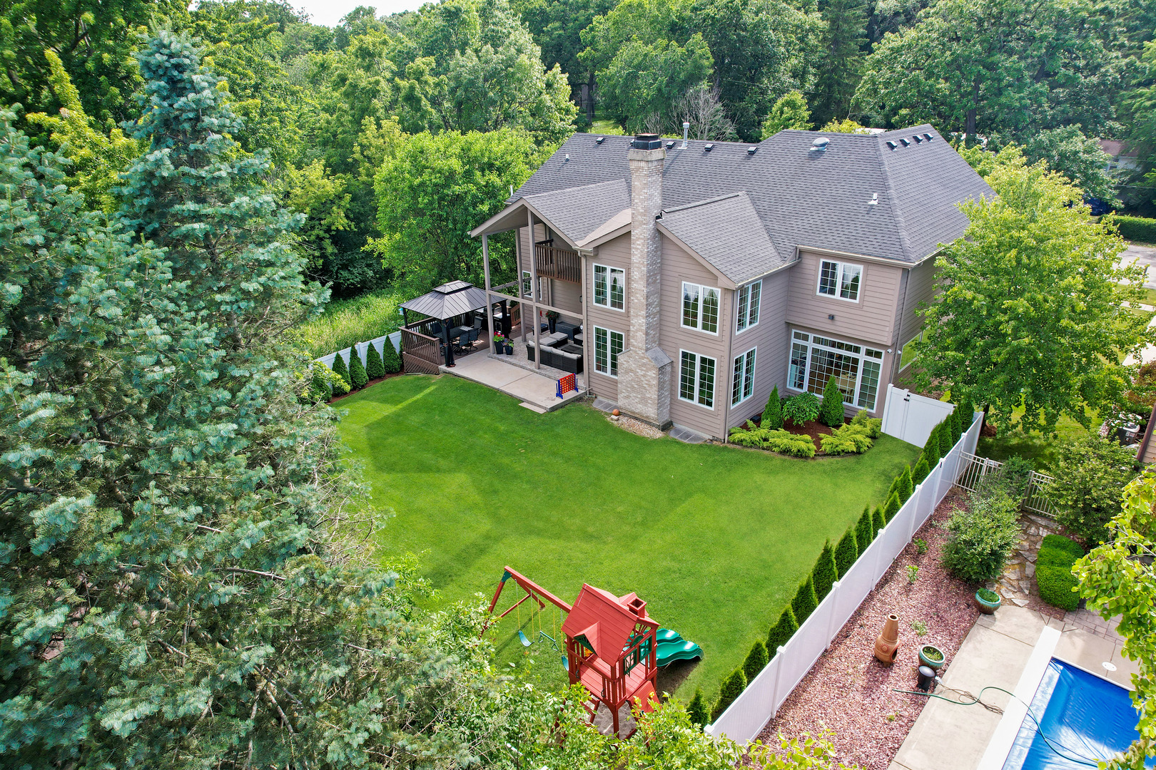 9033 Kearney Road Darien, IL 60561 - Photo 4 of 38 a aerial view of a house with swimming pool and a yard