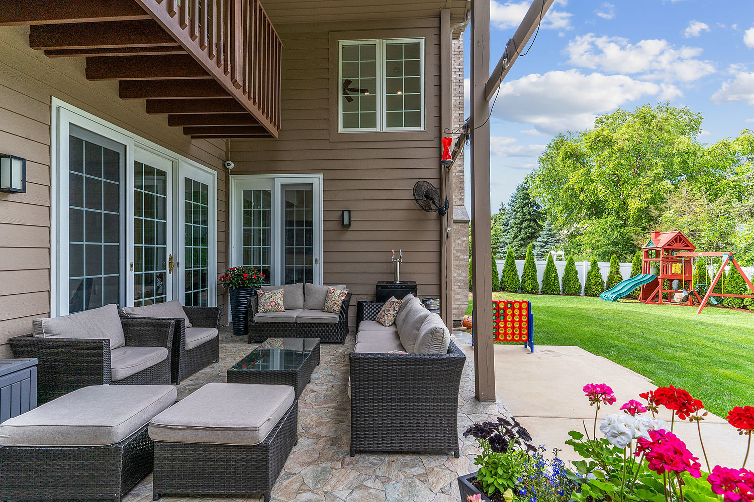 9033 Kearney Road Darien, IL 60561 - Photo 9 of 38 a view of a patio with couches table and chairs and garden