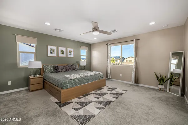a bedroom with a bed and window