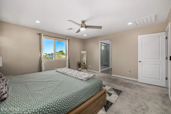 a bed room with a bed and a chandelier