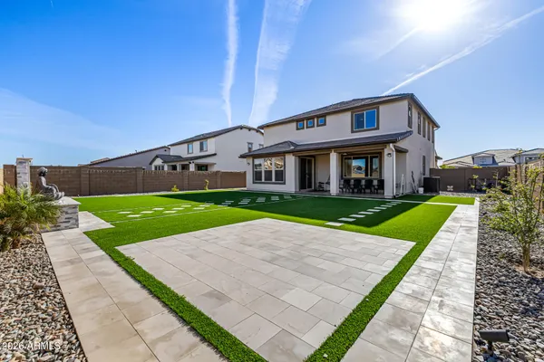 a view of house with a yard