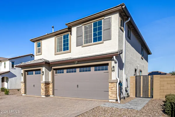 a front view of a house with a garage