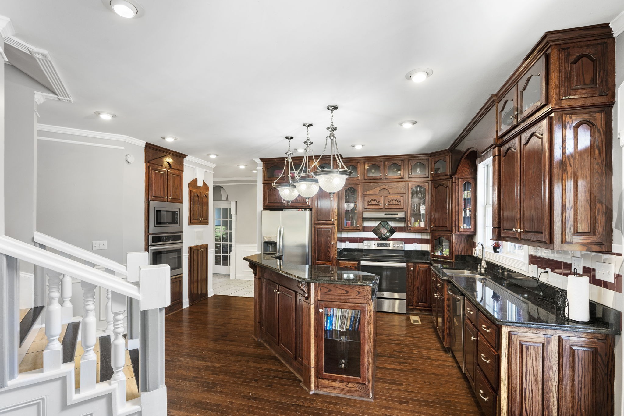265 Dorris Road Portland, TN 37148 - Photo 24 of 37 a kitchen with stainless steel appliances kitchen island granite countertop a stove refrigerator and cabinets