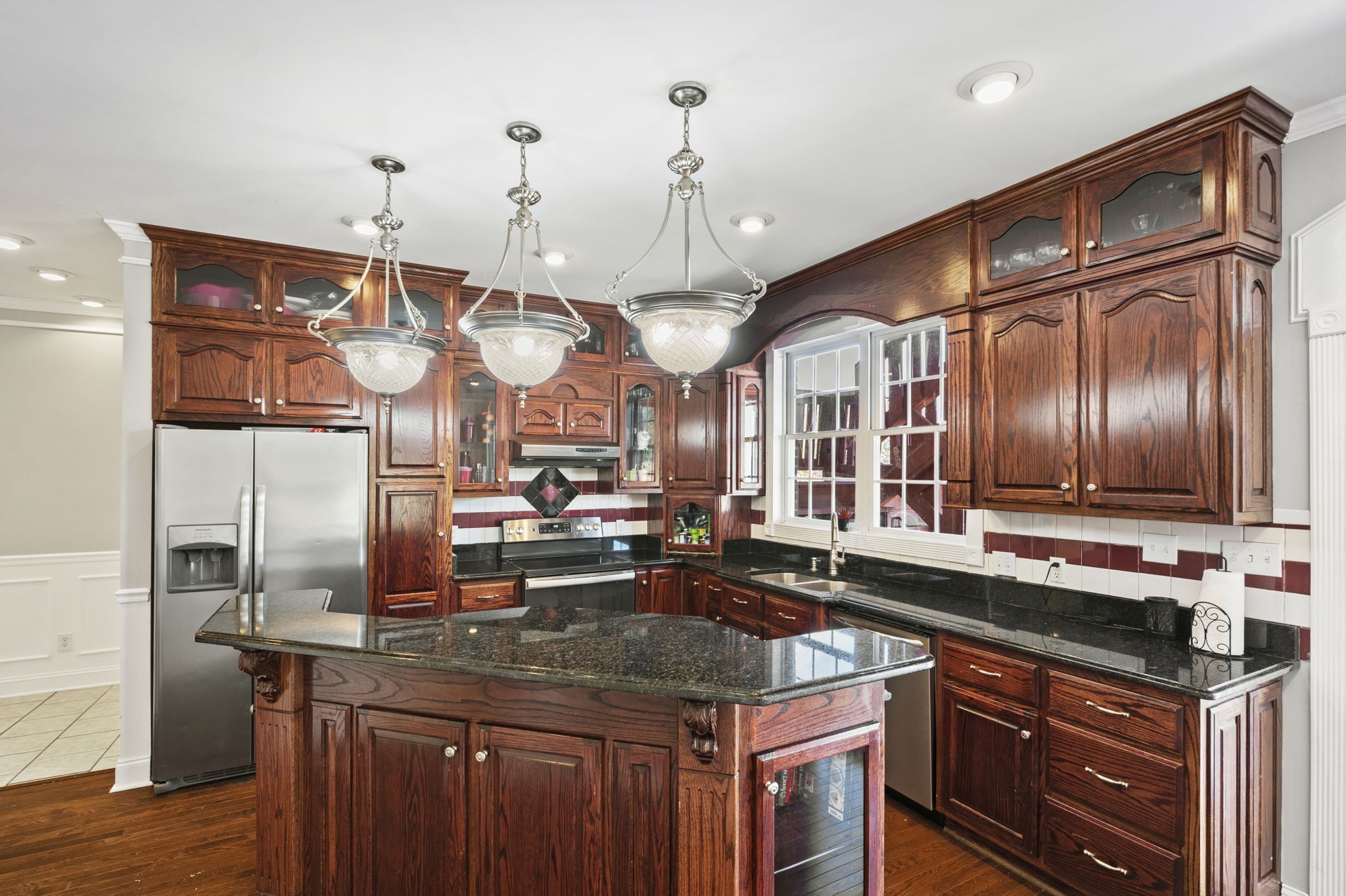 265 Dorris Road Portland, TN 37148 - Photo 25 of 37 a kitchen with cabinets and wooden floor