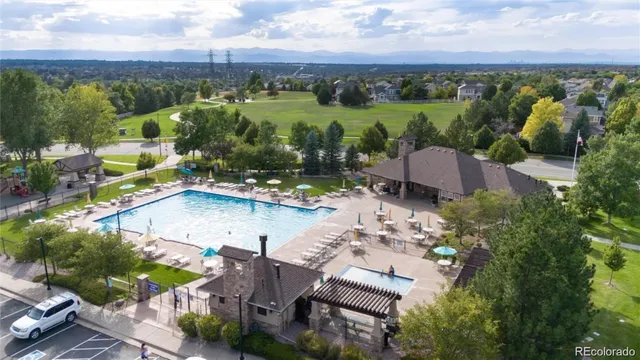 an aerial view of a house with pool lake view and mountain view