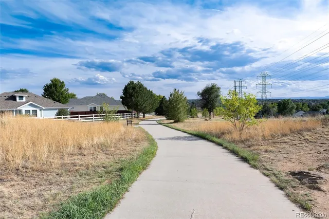 a view of swimming pool with a yard
