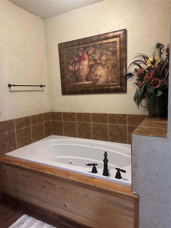 572 Oak Point Drive May, TX 76857 - Photo 27 of 36 Full bath featuring a whirlpool tub
