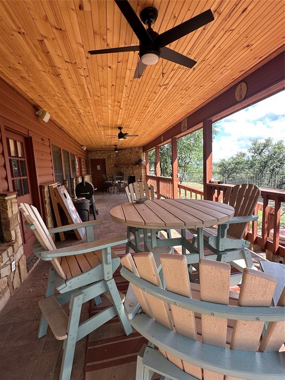 572 Oak Point Drive May, TX 76857 - Photo 33 of 36 View of patio featuring outdoor dining area and a ceiling fan