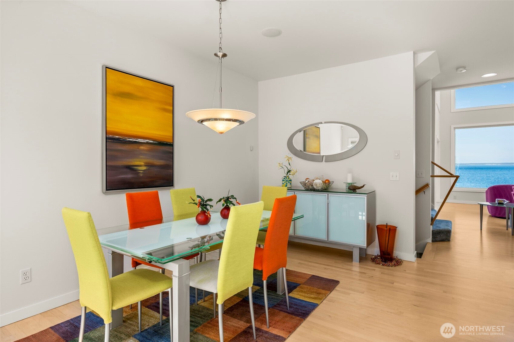 6436 South Ebb Tide Lane Freeland, WA 98249 - Photo 12 of 40 a view of a dining room with furniture and wooden floor