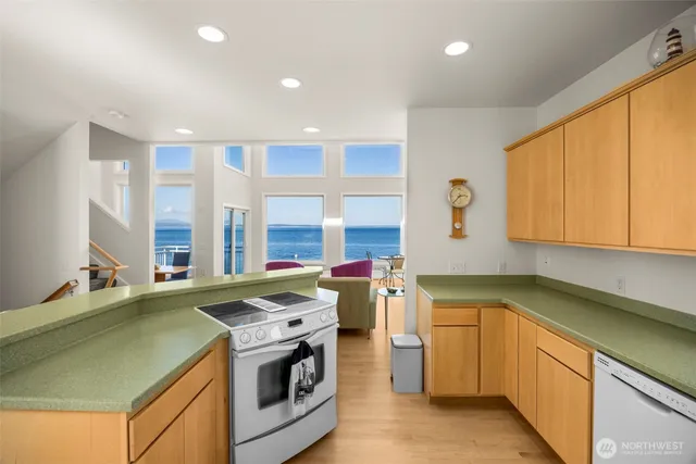 a living room with kitchen island furniture and a wooden floor