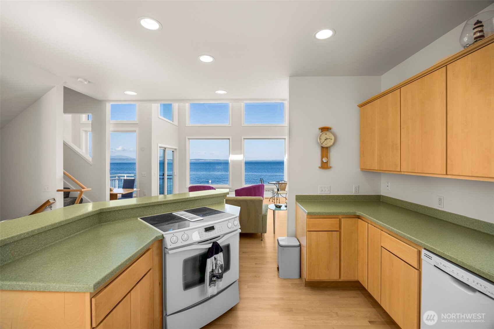 6436 South Ebb Tide Lane Freeland, WA 98249 - Photo 13 of 40 a kitchen that has a sink and a stove in it