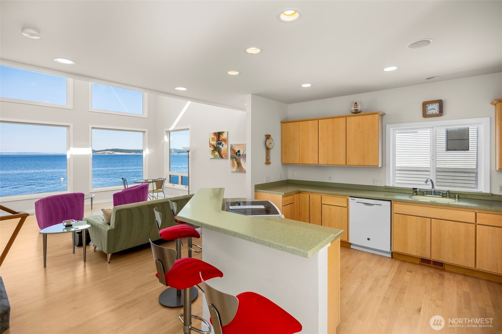 6436 South Ebb Tide Lane Freeland, WA 98249 - Photo 14 of 40 a living room with kitchen island furniture and a wooden floor