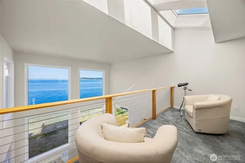 a view of a hallway view with wooden floor and staircase