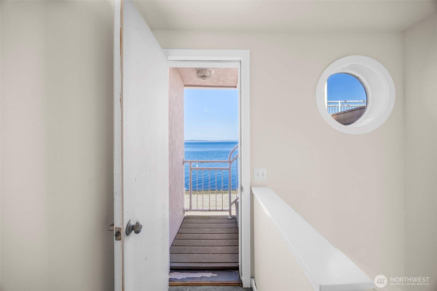 6436 South Ebb Tide Lane Freeland, WA 98249 - Photo 21 of 40 a view of a hallway view with wooden floor and staircase