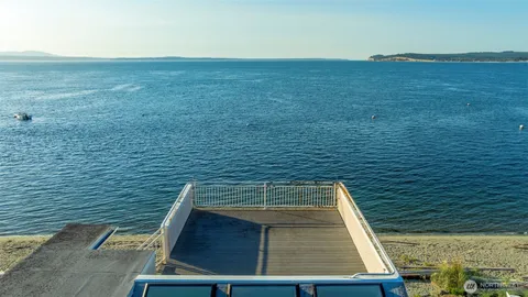 a bathroom with a tub and a window