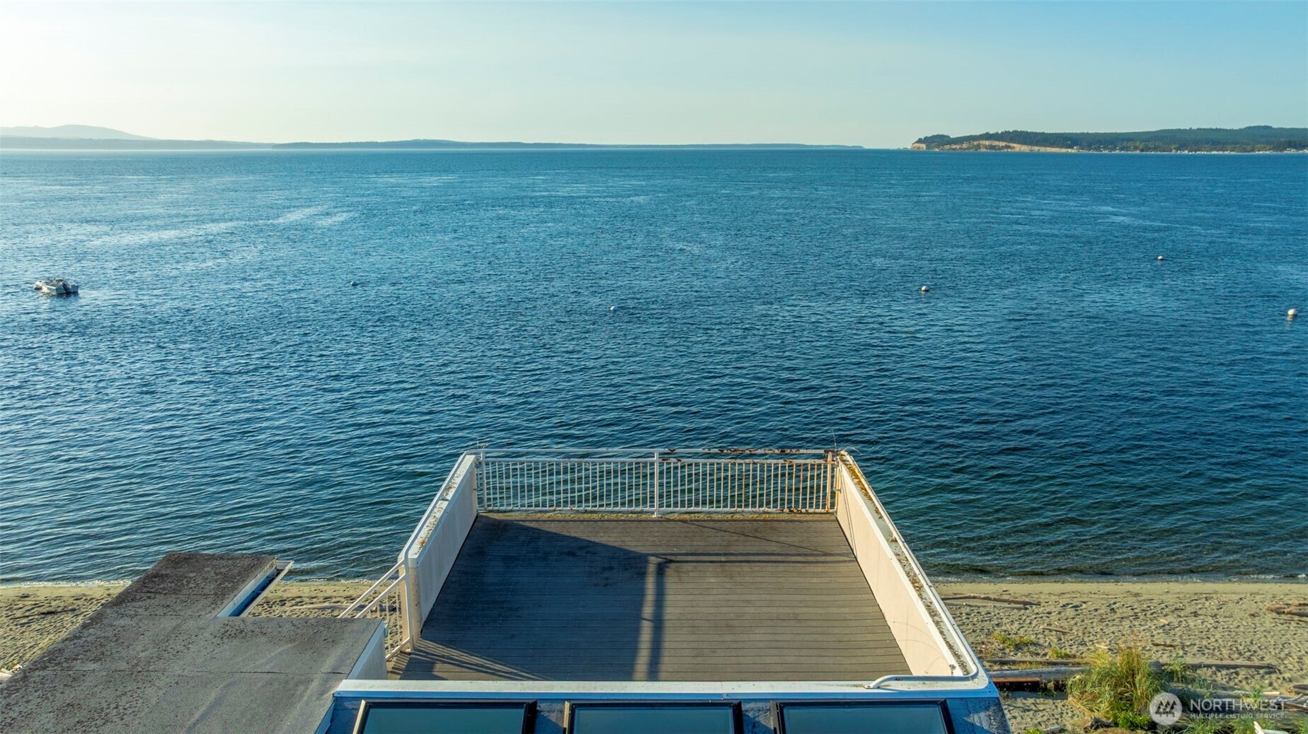 6436 South Ebb Tide Lane Freeland, WA 98249 - Photo 23 of 40 a view of roof deck with wooden floor and fence