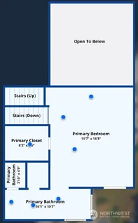 a bed sitting in a bedroom next to a lamp