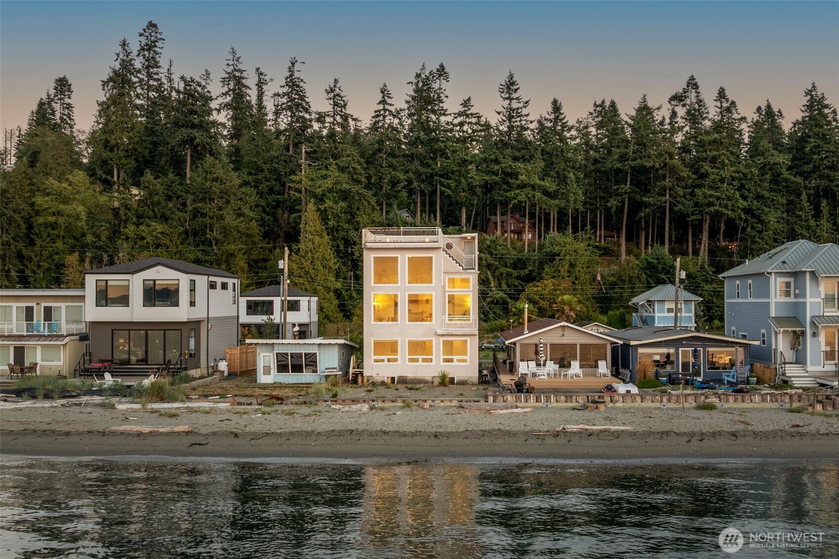6436 South Ebb Tide Lane Freeland, WA 98249 - Photo 3 of 40 a front view of a house with a yard and trees