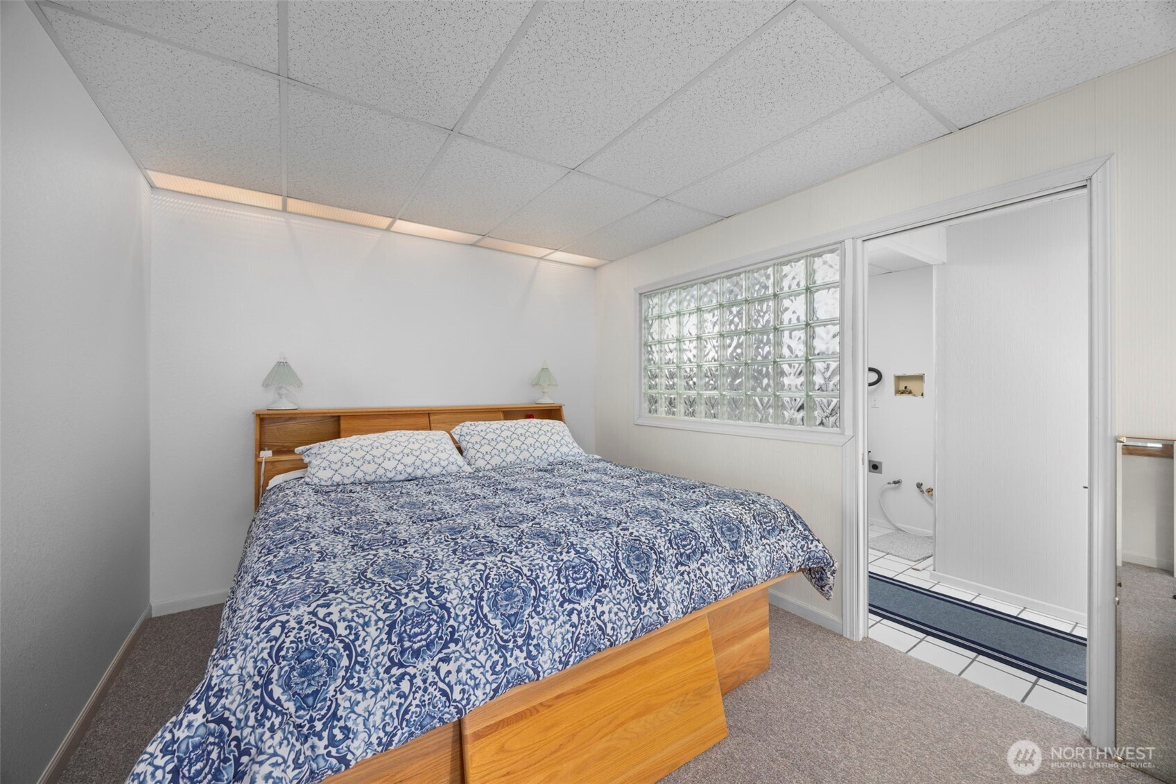 6436 South Ebb Tide Lane Freeland, WA 98249 - Photo 35 of 40 a bedroom with a bed and dresser