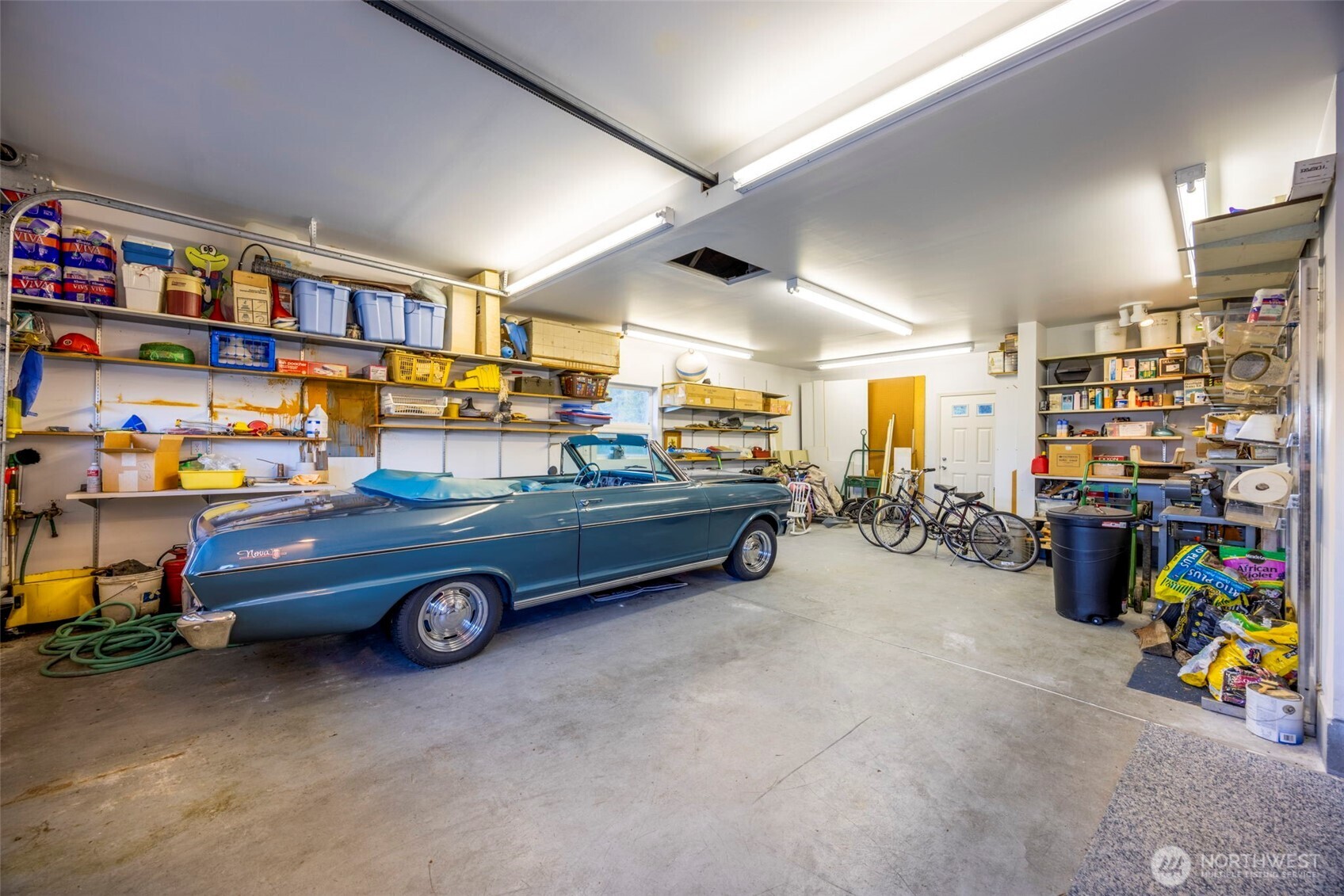 6436 South Ebb Tide Lane Freeland, WA 98249 - Photo 37 of 40 a car is parked in a garage