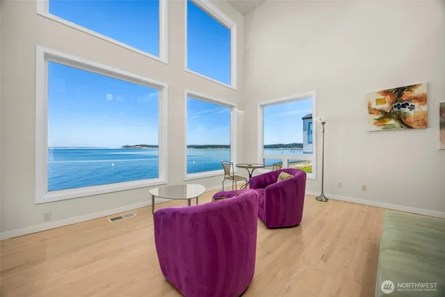 a living room with furniture rug and wooden floor