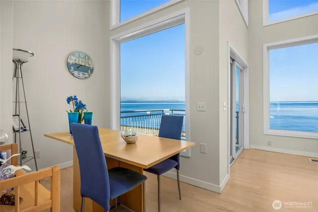 a view of a dining room with furniture and a window