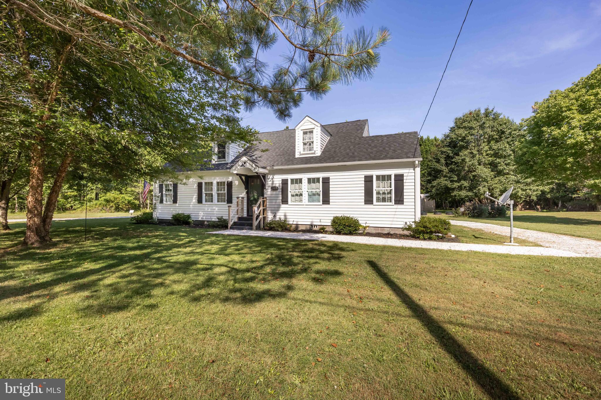 23078 Nanticoke Road Quantico, MD 21856 - Photo 1 of 67 a front view of a house with a garden