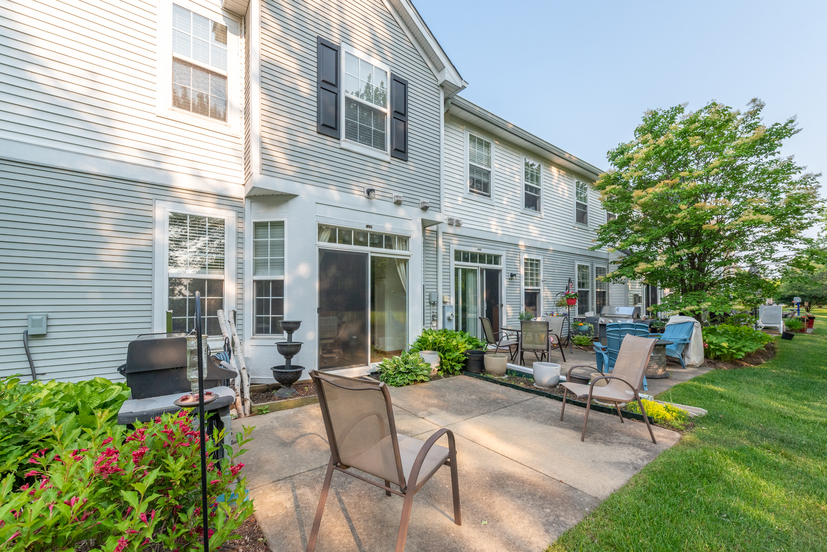 1430 Millbrook Drive Algonquin, IL 60102 - Photo 20 of 25 a view of a house with backyard sitting area and garden