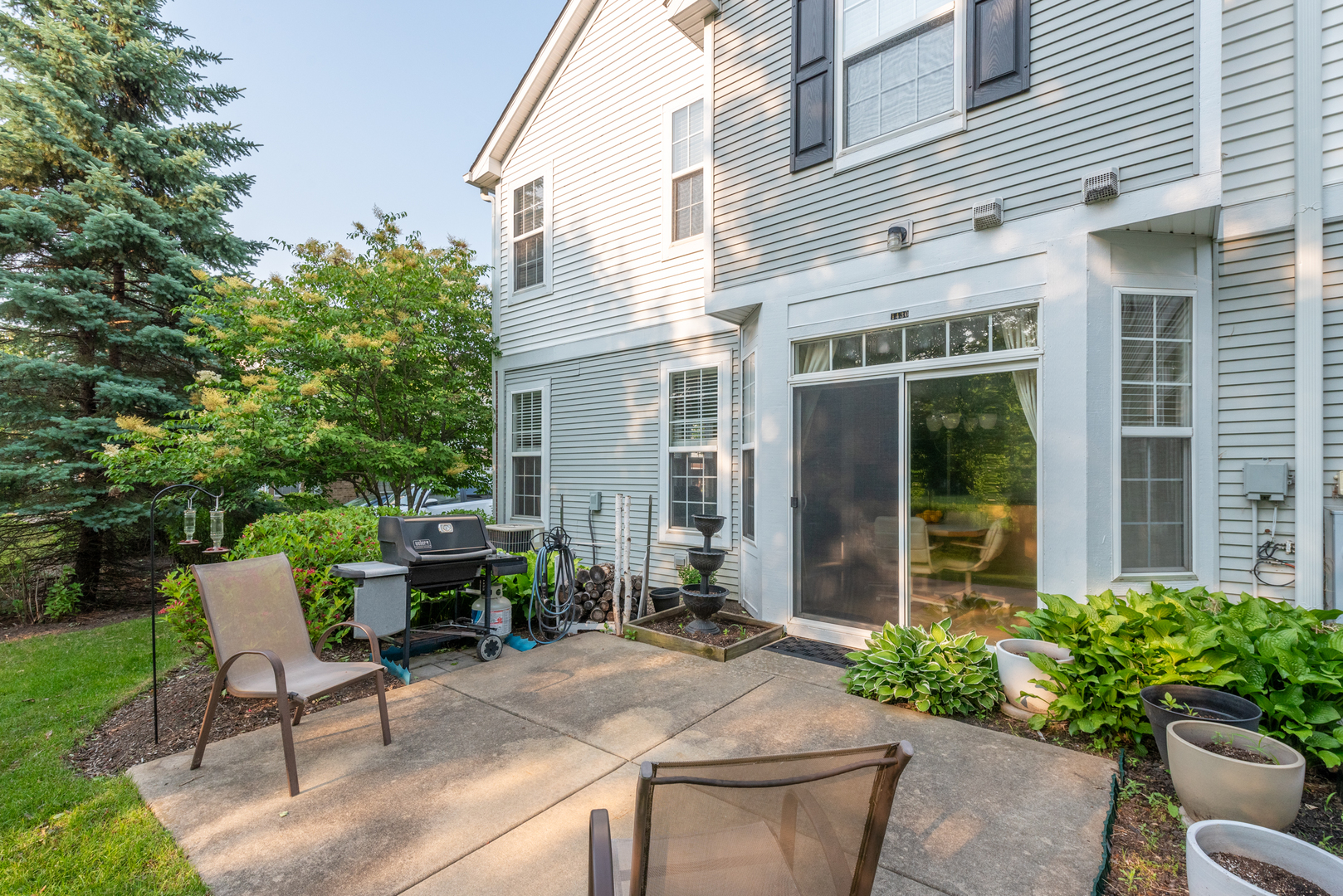 1430 Millbrook Drive Algonquin, IL 60102 - Photo 22 of 25 a view of a chair and table in backyard of the house