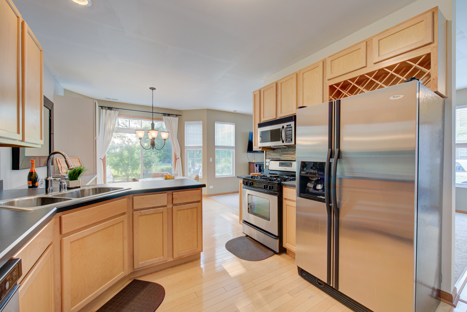 1430 Millbrook Drive Algonquin, IL 60102 - Photo 8 of 25 a kitchen with granite countertop stainless steel appliances a sink and counter space